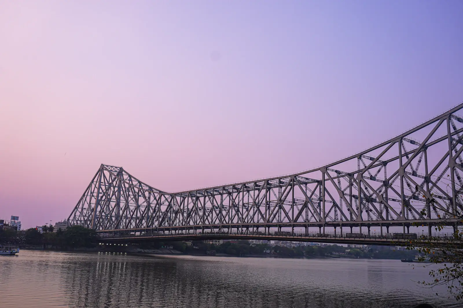 Howrah Bridge over the Hooghly river at dusk, Kolkata