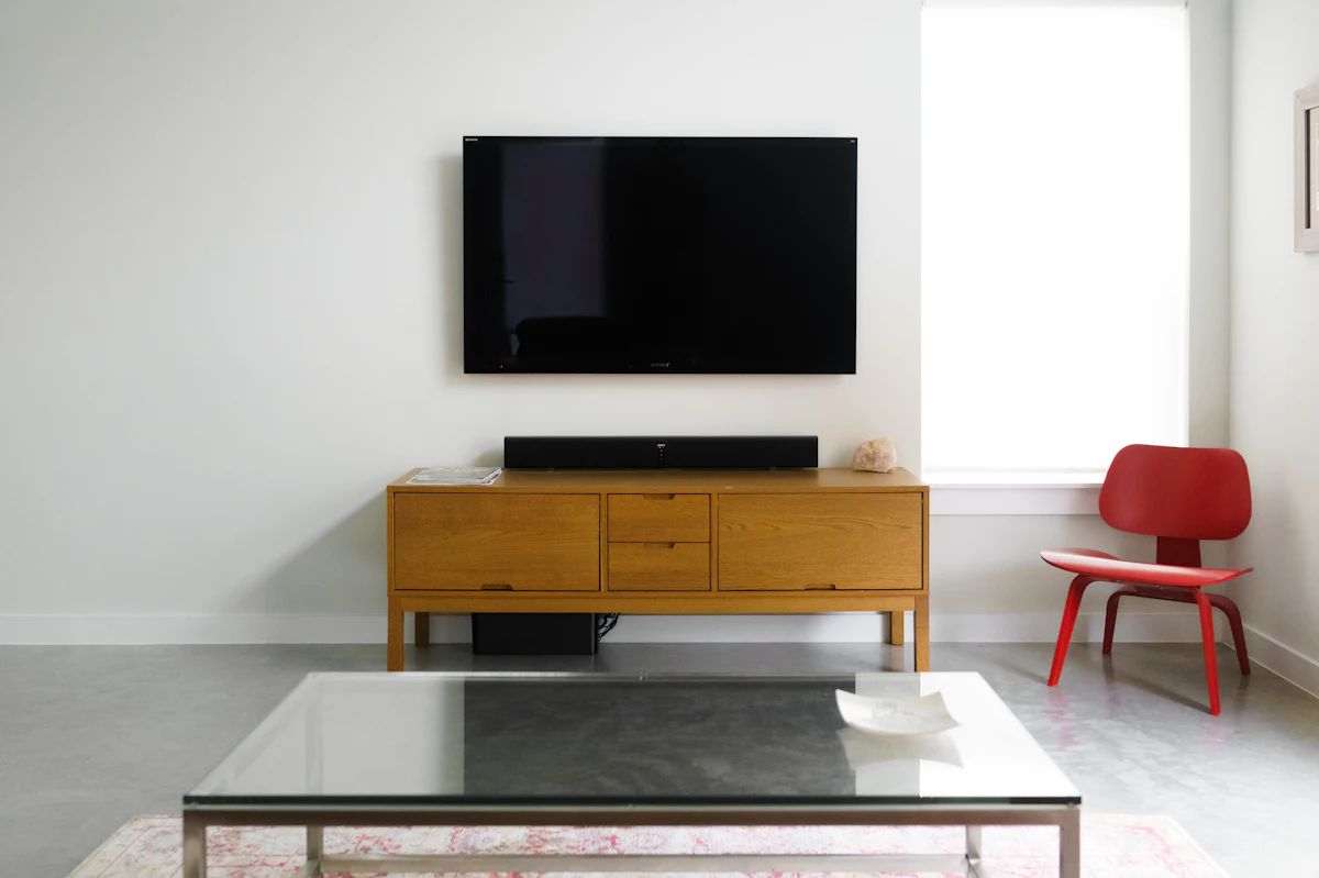 Flat screen Videocon style LED TV on a wooden console