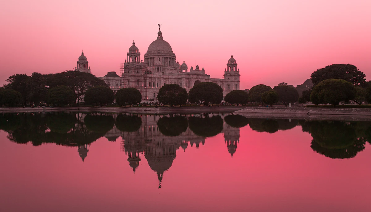 Victoria Memorial reflected in water at sunset, Kolkata